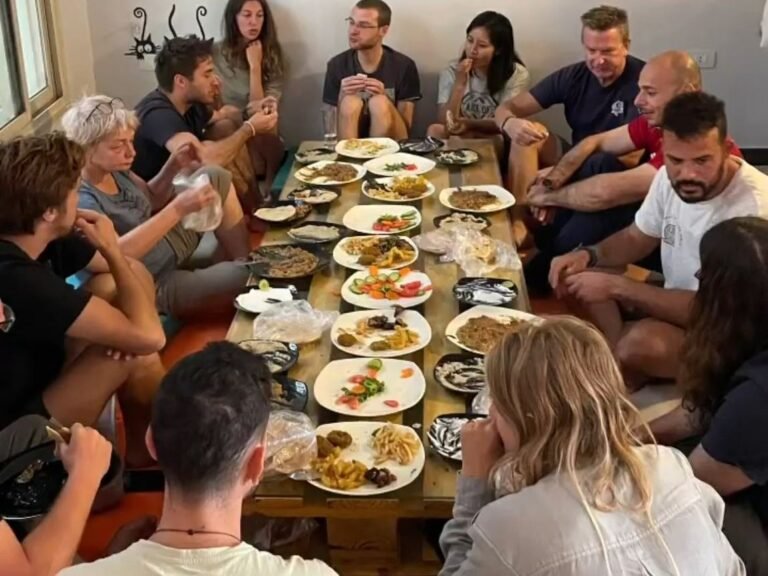The whole group eating dinner together at one long table